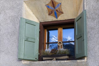 Windows on historic house, sgraffito, facade decorations, shutters, Guarda, Engadin, Grisons,