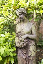 Classical style female cast iron statue figure statue, The Walled garden plant nursery, Benhall,