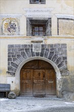 House entrance door, window, historic house, sgraffito, facade decorations, Ardez, Engadin,