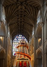 Traditional helter skelter fairground ride inside cathedral church at Norwich, Norfolk, England,