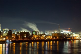 Night shot of BASF in Ludwigshafen with the Rhine in the foreground