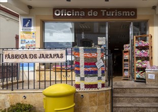 Textile products on display Oficina de Turismo tourist information shop and office, village of