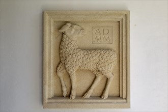 Millennium sculpture Sebastian Brooke carved relief of lamb in porch of Saint John the Baptist