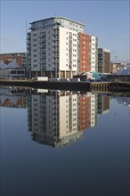 Modern apartments architecture reflected in water Ipswich Wet Dock waterside redevelopment,