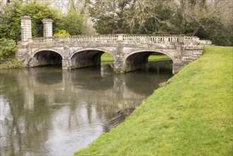 Historic ornamental stone bridge over River Avon in Amesbury Abbey Park, Amesbury, Wiltshire,