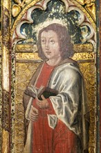 Medieval paintings of saints on rood screen inside church of Saint Andrew, Bramfield, Suffolk,