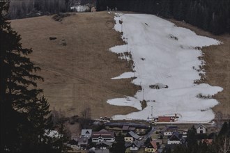 A partially melted piste can be seen on a slope, taken in the Jizera Mountains ski resort near