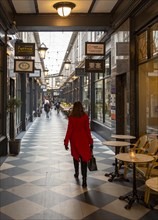 Shoppers walking in High Street arcade in city centre of Cardiff, South Wales, UK