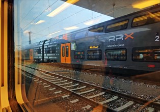 View from a train onto a double-decker regional train operated by National Express, Duesseldorf,