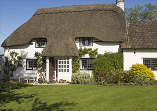 Pretty thatched country cottage and garden, Cherhill, Wiltshire, England, UK, property released