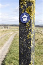 Route marker sign for the White Horse Trail across chalk downland, Marlborough Downs, Wiltshire,