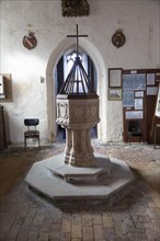 Baptismal font in church of Ilketshall St Andrew, Suffolk, England, UK
