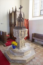 Church of Saint Mary, Newbourne, Suffolk, England, UK. carved figures stone baptismal font