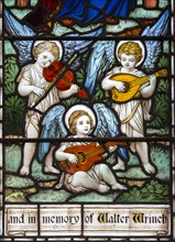 Detail of stained glass window three angels playing music by Powell and Son c 1915, Erwarton