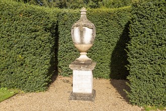 18th century stone memorial sculpture in garden, Audley End House and Gardens, Essex, England, UK