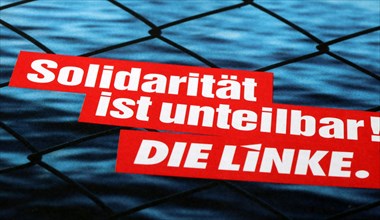 Symbolic image Die Linke: Flyer with the slogan Solidarity is indivisible