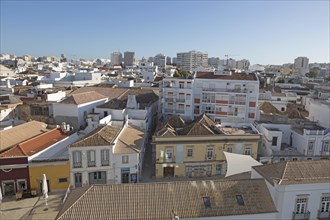 High density roof top view of buildings crowded together in the city centre of Faro, Algarve,