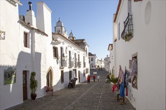 Historic cobbled street whitewashed buildings walled hilltop village of Monsaraz, Alto Alentejo,