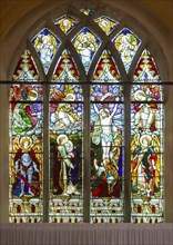 Stained glass east window of the Crucifixion by Jones and Willis 1907, Rendham church, Suffolk,
