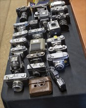 Vintage camera collection on table for sale at auction, Suffolk, England, UK