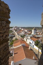 View over rooftops of whitewashed houses and streets in the small rural settlement village of