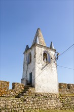 Battlements stone ramparts and watch tower in historic castle ruins at Arraiolos, Alentejo,