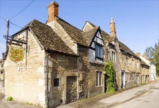 Historic former Red Lion pub in Melksham, Wiltshire, England, UK row cottages Cotswold stone
