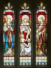 Stained glass window Faith, Charity, Hope church of Saint Swithin, Combe, Berkshire, England, UK
