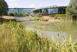 Lake water feature landscaped grounds of Reading International Business Park, Reading, Berkshire,