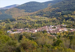 Autumnal countryside landscape view of forests, mountains and village of Valganon, La Rioja, Spain,
