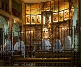 Nuns in white habits praying singing in convent, Convento de las Esclavas, Cuenca, Castille La