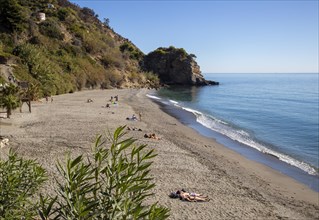 Sandy beach of Playa de Maro, near Nerja, Andalusia, Spain with calm Mediterranean Sea, out of