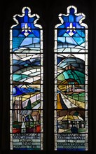 Modern stained glass window in church of Saints Peter and Paul, Marden, Wiltshire, England, UK by
