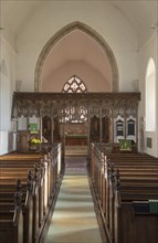 Elaborately decorated wooden rood screen in church of Saint Andrew, Bramfield, Suffolk, England, UK