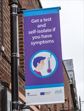 Get a test and self-isolate if you have symptoms Covid 19 information poster, Newbury, Berkshire,
