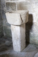 Simple stone baptismal christening font Saxon church of Saint Laurence, Bradford on Avon,