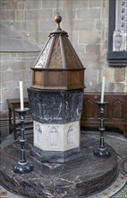 Interior of the priory church at Edington, Wiltshire, England, UK, baptismal font