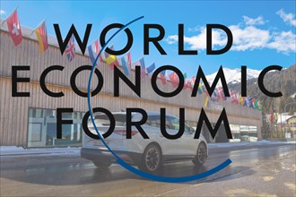Logo of the WEF (World Economic Forum), in the background the Davos Congress Centre