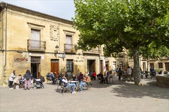 People sitting outside a cafe in Plaza Mayor, village of San Vicente de la Sonsierra, La Rioja,
