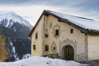 Historic house, sgraffito, facade decorations, mountain peak, snow, winter, Guarda, Engadin,