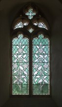 Stained glass window by Consantine Woolnough circa 1855, floral design blue green glass, church of