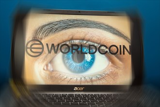 Logo of the new cryptocurrency Worldcoin on a laptop. Anyone wishing to participate in World Coin