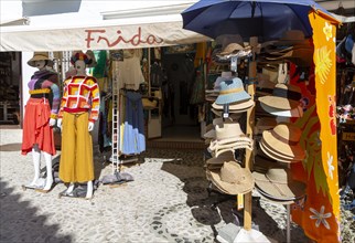 Souvenir shop with clothing and hats on display, Frigiliana, Axarquia, Andalusia, Spain, Europe
