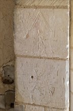 Initials names graffiti carved into stone of doorway at Church of St George South Elmham St Cross,