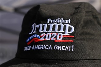 Convinced Trump supporter in Germany wears a cap with the campaign slogan Trump 2020 - keep America