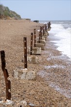 Remnants of old wartime coastal defences 1940s anti-invasion military structures, Bawdsey, Suffolk,