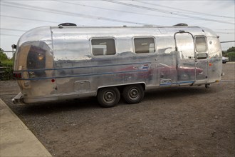 Vintage Airstream silver trailer caravan on display at an auction, Suffolk, England, UK