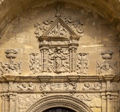 Detail of stonework carvings above doorway to church of Santa Maria de la Asuncion, Briones, La