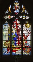 Stained glass window of Saint Nicholas standing in ship by Martin Travers 1927 Cricklade church,