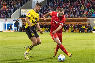 Football match, Niclas FUeLLKRUG Borussia Dortmund in a duel with Benedikt GIMBER 1.FC Heidenheim